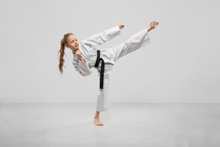 active-female-teenager-practising-karate-studio_7502-4329